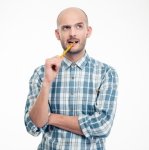 Man Thinking With Pencil in Mouth