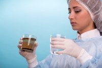 Woman Holding 2 Glasses of Water